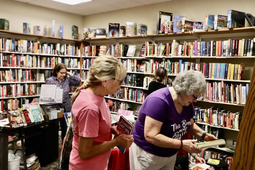 People shopping in the Friend's store in the Pensacola Library.